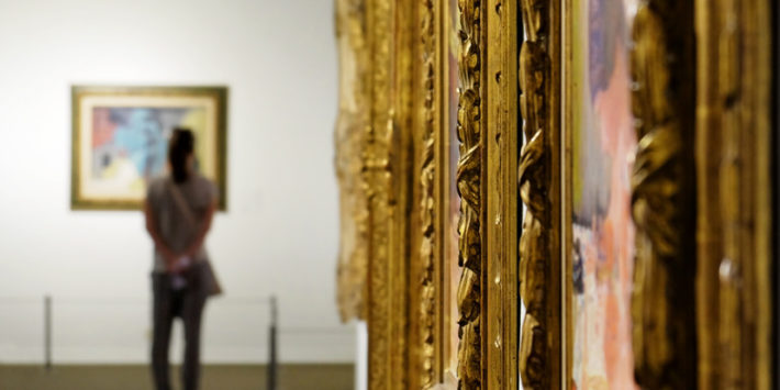 TEL AVIV, ISRAEL - APRIL 12, 2016: Girl looks at a painting at the Museum of Art