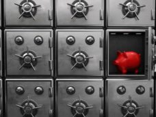 A red piggy bank in the opened strongbox. 3d illustration.